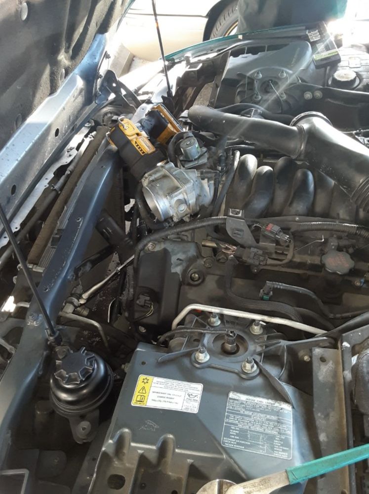 Impact driver and test gear over a Westminster engine bay